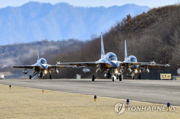 T-50B superso<em></em>nic jets of the South Korean Air Force's Black Eagles aerobatic team move along a runway at an air ba<em></em>se in Wonju, 130 kilometers east of Seoul, on Feb. 15, 2023, before they take off to join an internatio<em></em>nal air show in Australia, in this photo provided by the armed service. (PHOTO NOT FOR SALE) (Yonhap)