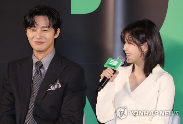 Singer-actor IU (R) and Park Seo-joon speak during a press co<em></em>nference for sports comedy film 