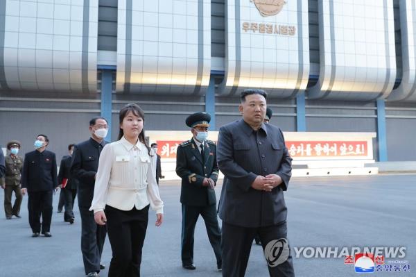 North Korean leader Kim Jong-un (R) and his daughter, known as Ju-ae, visit the North's space development agency on April 18, 2023, in this photo released by the North's official Korean Central News Agency the next day. (For Use o<em></em>nly in the Republic of Korea. No Redistribution) (Yonhap)