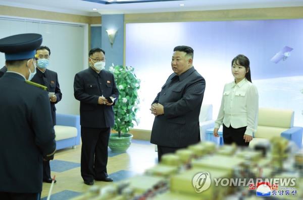 North Korean leader Kim Jong-un (2nd from R) and his daughter, known as Ju-ae, visit the North's space development agency on April 18, 2023, in this photo released by the North's official Korean Central News Agency the next day. (For Use o<em></em>nly in the Republic of Korea. No Redistribution) (Yonhap)