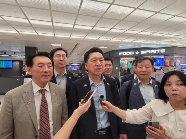 Rep. Kim Gi-hyeon (third from L), head of the ruling People Power Party, speaks to reporters after arriving in Washington on July 10, 2023. (Yonhap)