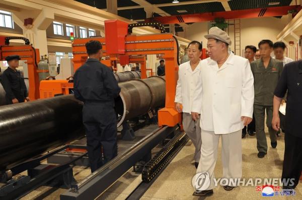 This photo, carried by the North's Korean Central News Agency on Aug. 6, 2023, shows North Korean leader Kim Jong-un giving field guidance at an arms factory. (For Use o<em></em>nly in the Republic of Korea. No Redistribution) (Yonhap)