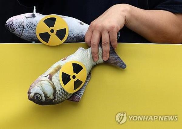 This photo taken Aug. 24, 2023, shows a performance by a South Korean civic group against Japan's release of co<em></em>ntaminated water from the Fukushima nuclear power plant. (Yonhap)