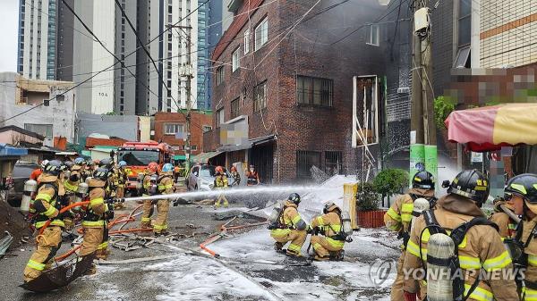 Firefighters battle a fire at a public bathhouse in the southern port city of Busan on Sept. 1, 2023, in this photo released by the Busan Metropolitan Police. (PHOTO NOT FOR SALE) (Yonhap)