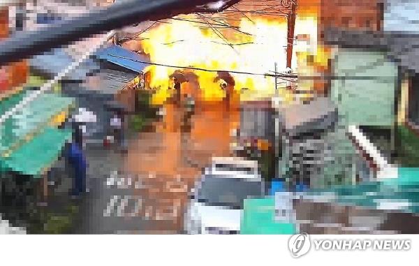 Flames rise during a fire at a public bathhouse in the southern port city of Busan on Sept. 1, 2023, in this security camera footage by the city's Dong-gu office. (PHOTO NOT FOR SALE) (Yonhap)