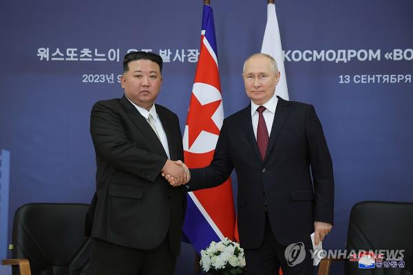 North Korean leader Kim Jong-un (L) shakes hands with Russian President Vladimir Putin ahead of their talks at the Vostochny Cosmodrome space launch center in the Russian Far East on Sept. 13, 2023, in this file photo released by the North's official Korean Central News Agency the next day. (For Use o<em></em>nly in the Republic of Korea. No Redistribution) (Yonhap)