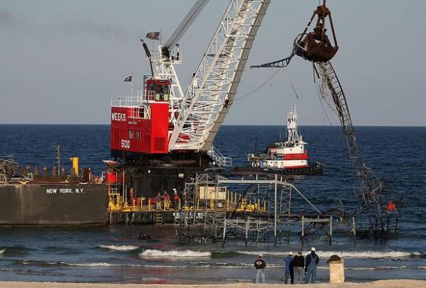 Pieces of track being plucked out of the water