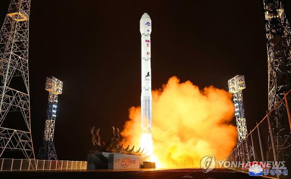 This photo, carried by North Korea's official Korean Central News Agency on Nov. 22, 2023, shows the North launching a military spy satellite, called the Malligyong-1, on a new type of Chollima-1 rocket the previous day. (For Use o<em></em>nly in the Republic of Korea. No Redistribution) (Yonhap)